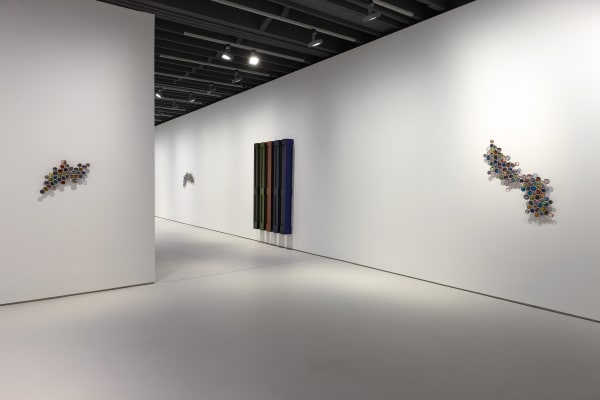 Jim Lambie's installation at the gallery 'Skin Shape' featuring ladders and other works. Skin Shape featured here,