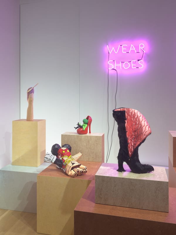 Installation view at WINDOW-Walker side close-up majority of shoes pictured including Julie's boot and David's neon.