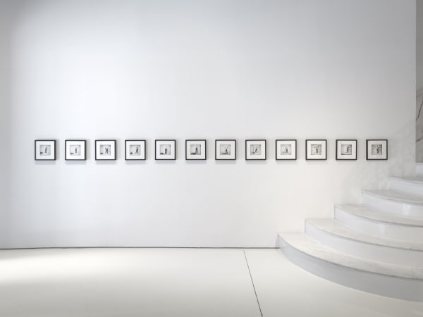 Framed photo works by the stairs.