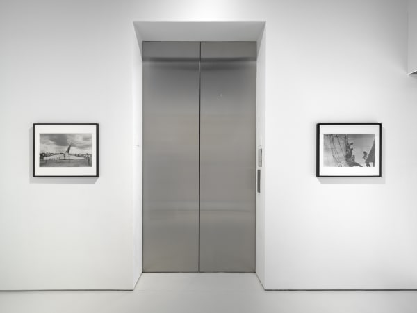 Metinides photographs by the elevator.