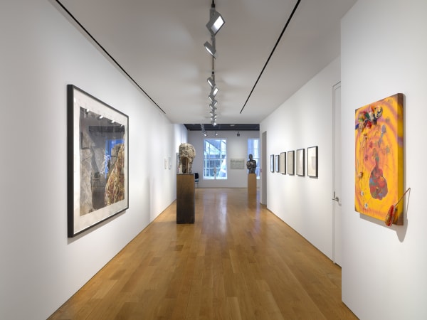 Long hallway view of works on the third floor.