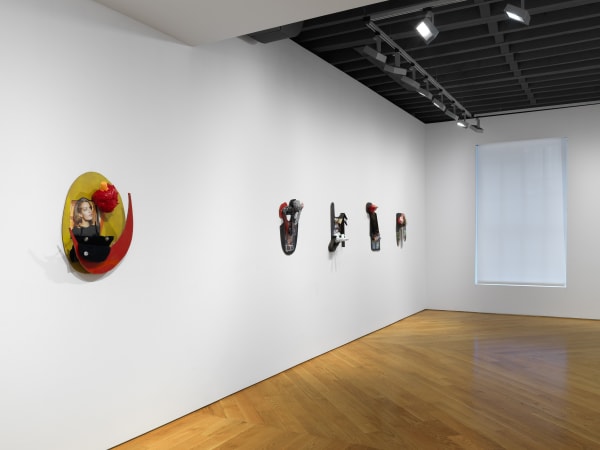 Installation view on the gallery's third floor of collages, which are 3 dimensional, unique, and vary in shape and content. Angled perspective showing the depth and texture of Bock's sculptural collages.