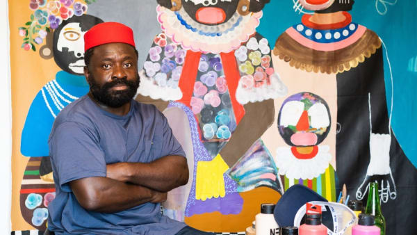 Kojo Marfo in front of his painting