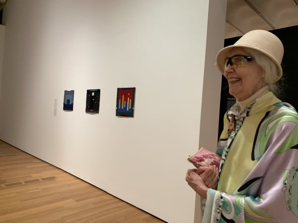 Jana Vander-Lee seen with three of her displayed works at the High Museum for the exhibition's opening.
