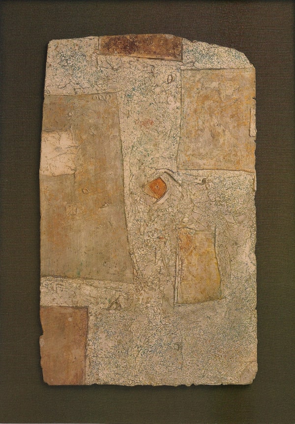 Brown piece of paper sitting on a darker brown background