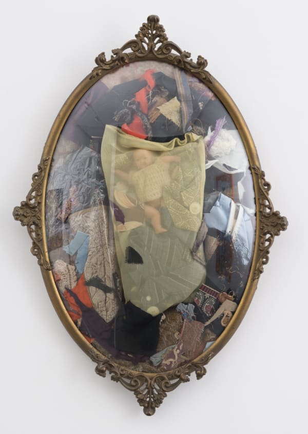 Mirror framed object with fabric inside of it