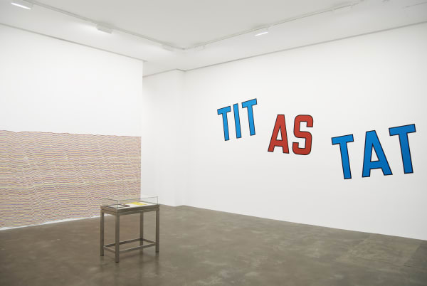 Installation view of  D.I.Y. exhibition, featuring Sol LeWitt's Wall Drawing #869 and Lawrence Weiner's TIT AS TAT.