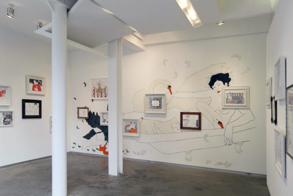 Installation view of a wall drawing by Hope Gangloff featuring a woman and swans