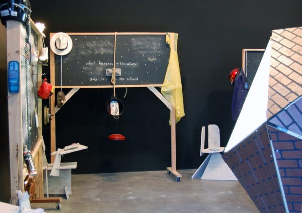 Installation with a chalkboard and draped fabrics