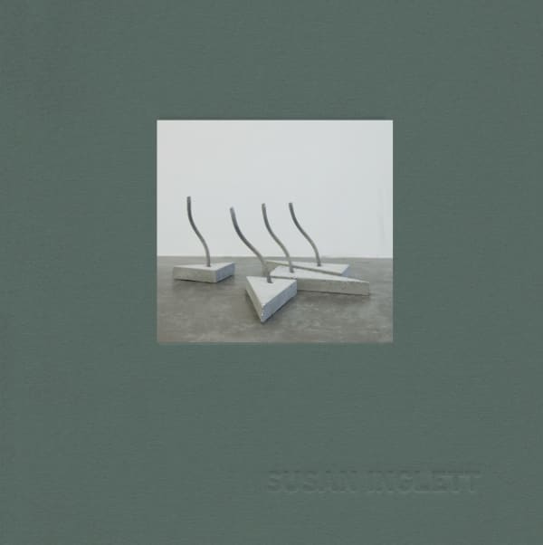 Green catalogue cover with image of four triangular slabs of concrete with short curved wires embedded
