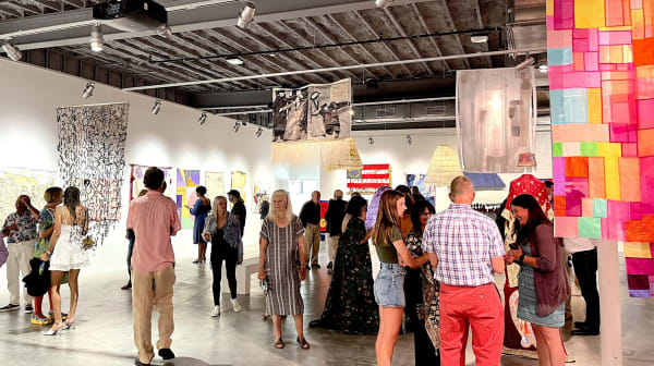 Crowd at the opening reception for the “Women Pulling at the Threads of Social Discourse” exhibition Thursday at MoCA Westport. / Contributed photos by Leslie LaSala