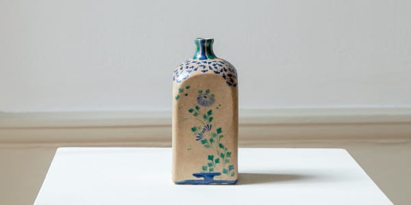 Kyō-yaki, 18th century, Edo period A saké flask with autumn flowers on each of the four sides. Glazed ceramic. Kyoto, Japan.