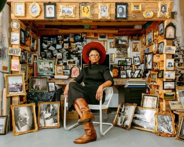 Allison Janae Hamilton in her studio in Chelsea, Manhattan, with her collection of family photographs. Credit: DeSean McClinton-Holland
