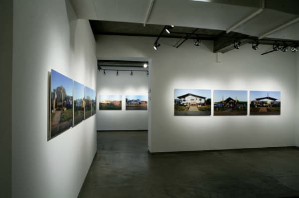 Three walls with Paul Aaron Johnson's work in gallery