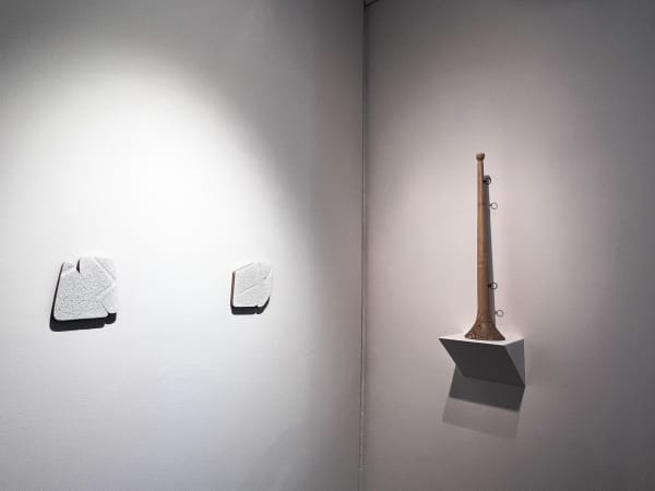 Left (Two Works) Kate Berry Brown Untitled, 2022 Carved wood, paper, and acrylic Left: 6 3/4 x 6 in. (17.1 x 15.2 cm.) Right: 6 3/4 x 6 3/4 in. (17.1 x 17.1 cm.) (KBB 25 and KBB 26) Right Artist Unknown Untitled, (Fraternal Lodge Ceremonial Trumpet) ca. 1885-1900 Polychrome on wood 28 x 5 1/2 x 5 1/2 in. (71.1 x 14 x 14 cm.)