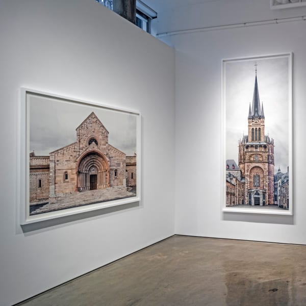 Installation View | Markus Brunetti: FACADES  Featured Artworks:  Markus Brunetti (German, b. 1965)  Ancona, Basilica Cattedrale di San Ciriaco, 2014  Archival Pigment Print  Image: 54 5/16” x 66 1/8” (138 x 168 cm)  Paper: 59” x 70 13/16” (150 x 180 cm)  Framed: 62" x 74" x 2 1/2” (157.5 x 188 x 6.3 cm), 1 1/4” face (3.2 cm)  Edition of 9 + 3 AP  Markus Brunetti (German, b. 1965)  Aachen, Kaiserdom, 2014-2015  Archival Pigment Print  Image: 113 3/8” x 54 5/16” (288 x 138 cm)  Paper: 118 3/16” x 59 1/16” (300 x 150 cm)  Framed: 119 15/16" x 60 13/16" x 2 1/2" (304.6 x 154.5 x 6.3 cm)  Edition of 9 + 3 AP