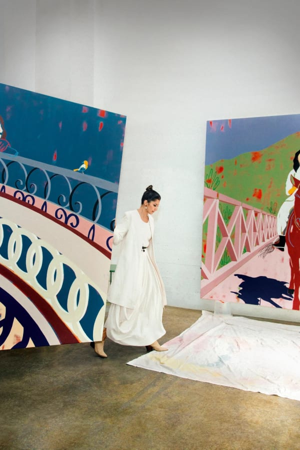 Anoushka Mirchandani with two of her works — Nightbird and Travellers. Photo credit: Anna-Alexia Basile