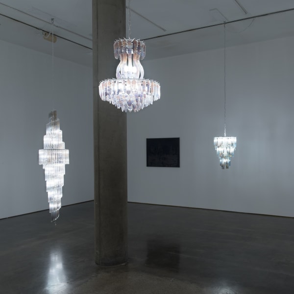 Installation View | Matthew Brandt: Carbon, Birch, Silver, Rooms  Featured Artworks:  Matthew Brandt (American, b. 1982)  Vanessa’s Foyer, 2021  Photographic Glass Chandelier Pieces with Painted Metal Armature  92" x 21" x 21" (234 x 53 x 53 cm)  Armature: 80" x 21" x 21" (203 x 53 x 53 cm)  Unique  (MBr.22907)  Matthew Brandt (American, b. 1982)  Tiffany’s Dining Room, 2021  Photographic Glass Chandelier Pieces with Painted Metal Armature  27" x 19" x 19" (68.5 x 48 x 48 cm)  Armature: 25" x 19" x 19" (63.5 x 48 x 48 cm)  Unique  (MBr.22906)  Matthew Brandt (American, b. 1982)  West Hills CA B, 2018-2020  Carbon Print with Ashes and Cinder collected from Woolsey Fire on Blackout Fabric  32 1/8” x 43 3/8” (81.5 x 110 cm)  Signed, Titled and Dated Verso in Pencil  Unique  (MBr.22902)  Matthew Brandt (American, b. 1982)  Marissa’s Bedroom, 2021  Photographic Glass Chandelier Pieces with Painted Metal Armature  29" x 19" x 21" (74 x 48 x 54 cm)  Armature: 23" x 19" x 19" (58.5 x 48 x 48 cm)  Unique  (MBr.22905)