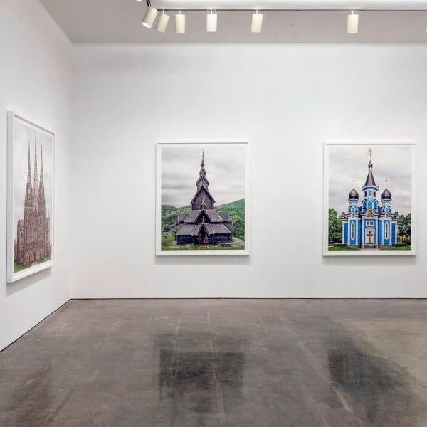 Installation View | Markus Brunetti: FACADES – Grand Tour  Featured Artwork:  Markus Brunetti (German, b. 1965)  Lichfield, Cathedral, 2014-2017  Archival Pigment Print  Image: 66 1/8” x 54 5/16” (168 x 138 cm)  Paper: 70 13/16” x 59” (180 x 150 cm)  From an Edition of 9 + 3 Artist’s Proofs  Markus Brunetti (German, b. 1965)  Borgund, Stavkyrkje, 2016-2017  Archival Pigment Print  Image: 66 1/8” x 54 5/16” (168 x 138 cm)  Paper: 70 13/16” x 59” (180 x 150 cm)  From an Edition of 9 + 3 Artist’s Proofs  Markus Brunetti (German, b. 1965)  Borgund, Stavkyrkje, 2016-2017  Archival Pigment Print  Image: 66 1/8” x 54 5/16” (168 x 138 cm)  Paper: 70 13/16” x 59” (180 x 150 cm)  From an Edition of 9 + 3 Artist’s Proofs