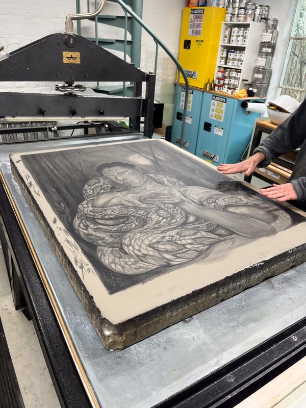 The lithography stone for Self portrait after Tiresias (2024) on the press at Petrichor. Image courtesy of Alina Perez and Petrichor Press, Philadelphia, PA.