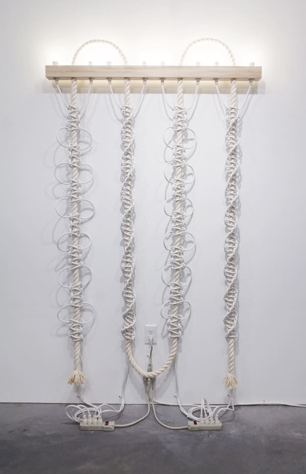 Dana Hemenway. Untitled (White Extension Cords, Rope), 2016; cotton rope, white extension cords, wood, compact fluorescent light bulbs, zip ties, power strips, paint; 77 x 48 x 3.5 inches. Courtesy of the artist and Eleanor Harwood Gallery, San Francisco.