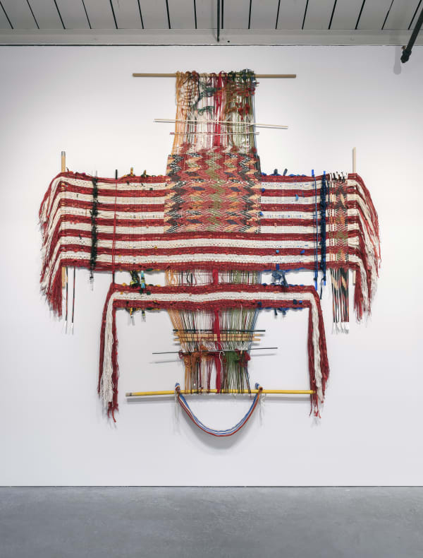 "Across," 2018, handspun and acid dyed wool, acrylic, cotton, metallic thread, novelty yarn, felt, wool rug mill ends, printed cotton fabric, artist's hair, leather, used Punjabi suit from artist's grandmother, detail from "Loom with Textile" (1874) printed on canvas, wood and plastic loom bars, zip ties, tacks