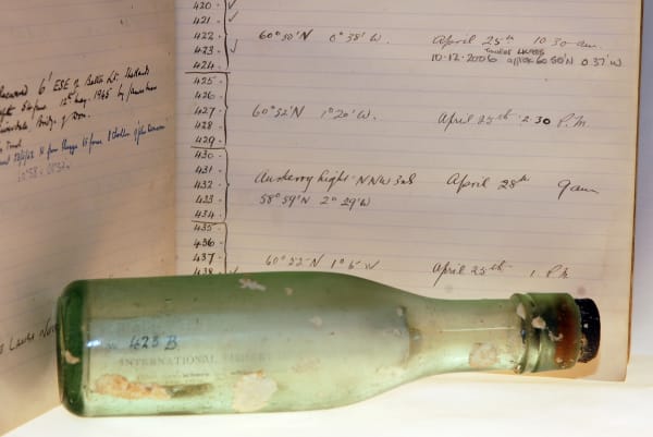 Historic glass drift bottle deployed in April 1914 by Captain Brown to study ocean currents in the northern North Sea. The bottle was recovered from almost the exact same position on 10 December 2006, a total of 92 years and 253 days spent at sea. (C) Marine Scotland and Crown Copyright