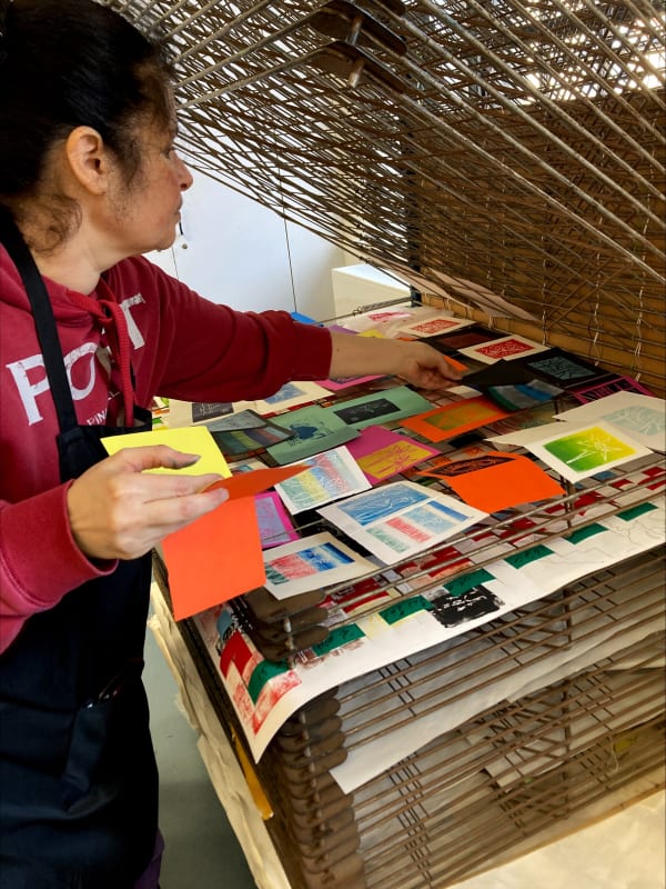 Attendees of free drop-in creative session in linocut.