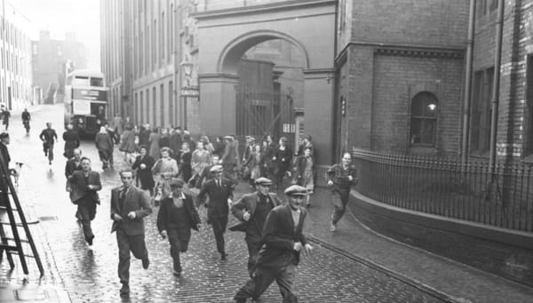 Archival photograph of North British Rubber Company workers leaving Castle Mills building.