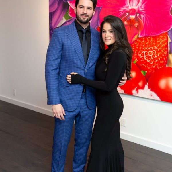 Alfredo Pellas and Isabel Arguello in front of Marc Quinn Painting