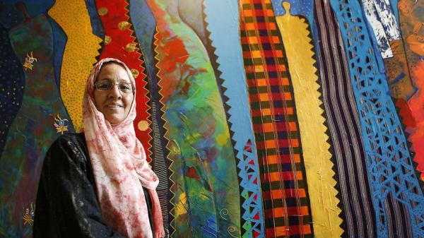 Najat Makki, with her work Illuminant Figures, which is on display in Dubai. Ravindranath K / The National