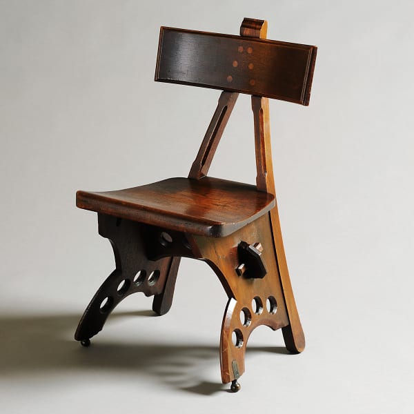 One of a pair of walnut chairs designed by E.W. Pugin, circa 1873