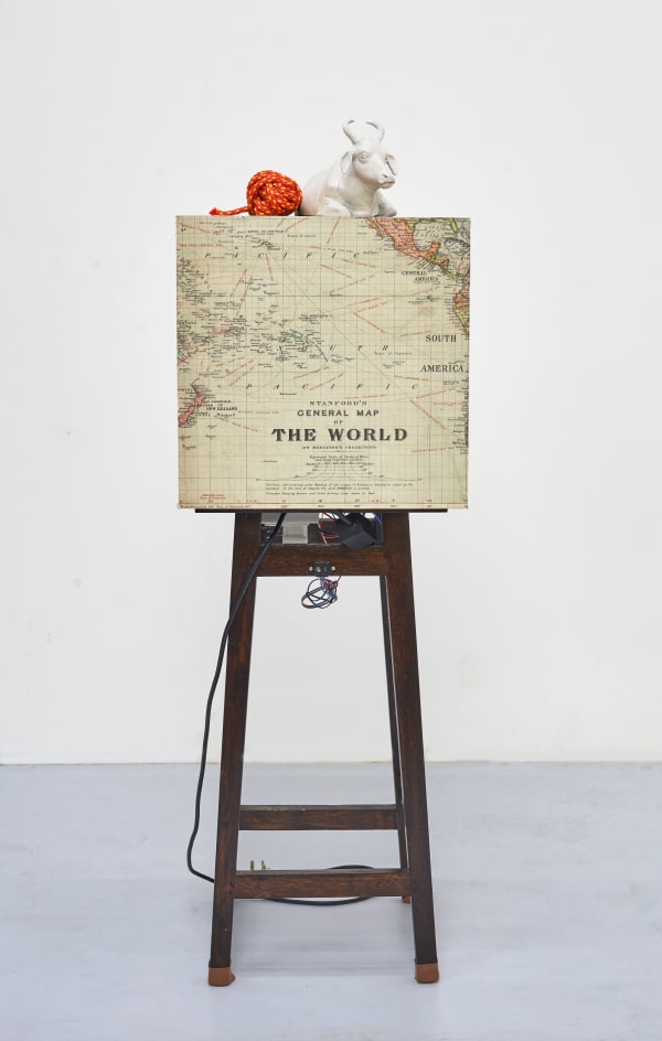 Shailesh B.R. The First Earthquake, 2015-2025 Kinetic sculpture , Concert vibrator, sensor, controllers, relay, power supply, Archival print and found Objects 53.25 x 16.25 x 16.25 in