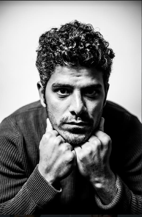 Meet Ali Kareem, the comedic force hailing from Denver. With three-time finalist accolades for "The Best Comedian in Omaha" by the Omaha Entertainment Arts & Awards Committee, Ali's comedic prowess knows no bounds. He clinched victory at the Omaha Funnybone Clash of Comics and has graced stages at renowned festivals like High Plains Comedy Festival, Boulder Comedy Festival, and Fountain Comedy Festival also featured on CPR. Originally from Baghdad, Ali's journey to the spotlight took a unique turn as he served as an interpreter for the United States Military in Iraq, eventually leading to his U.S. citizenship. Catch him spreading laughter across Colorado, one punchline at a time.
