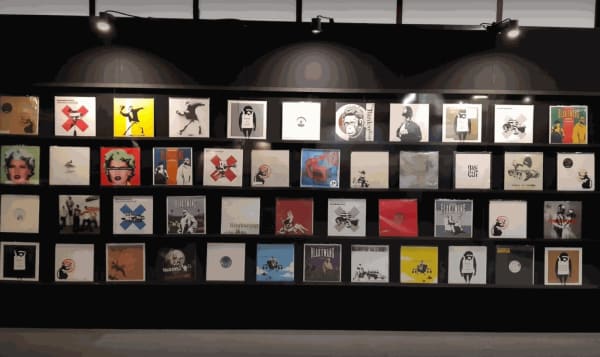 Banksy artworks hanging on wall