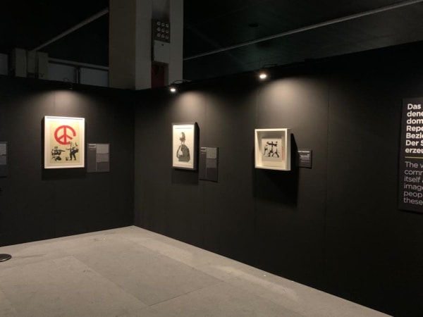 Banksy artworks hanging on wall