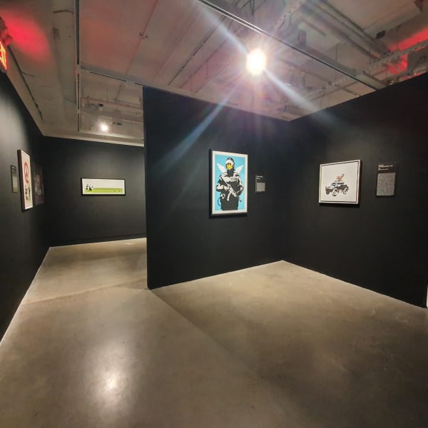 Banksy artworks hanging on wall