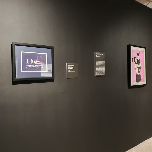 Banksy artworks hanging on wall