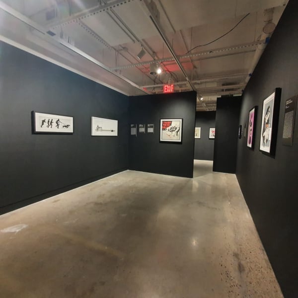 Banksy artworks hanging on wall