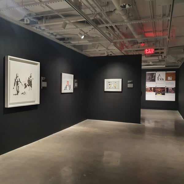 Banksy artworks hanging on wall