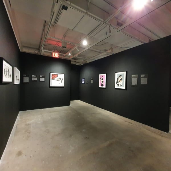 Banksy artworks hanging on wall