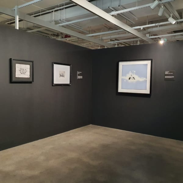 Banksy artworks hanging on wall