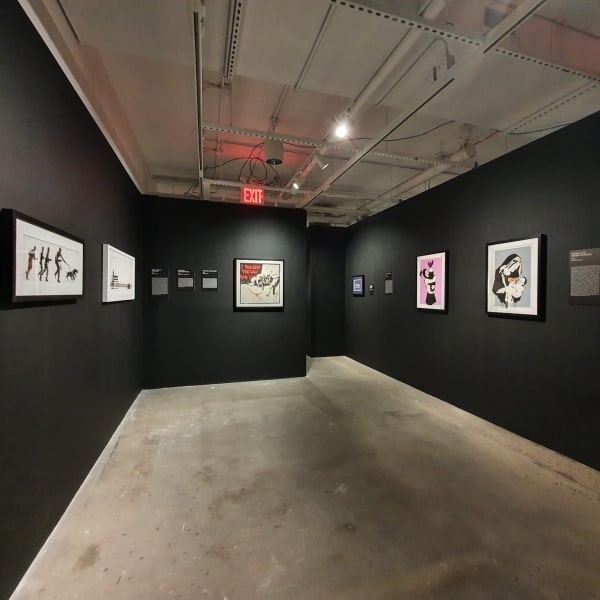 Banksy artworks hanging on wall