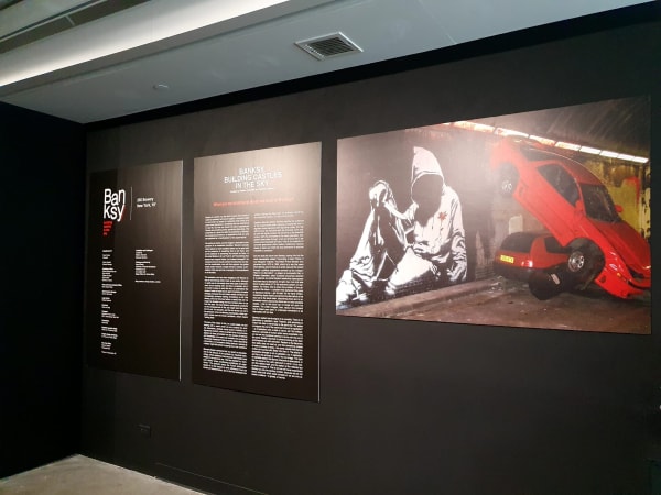 Banksy artworks hanging on wall