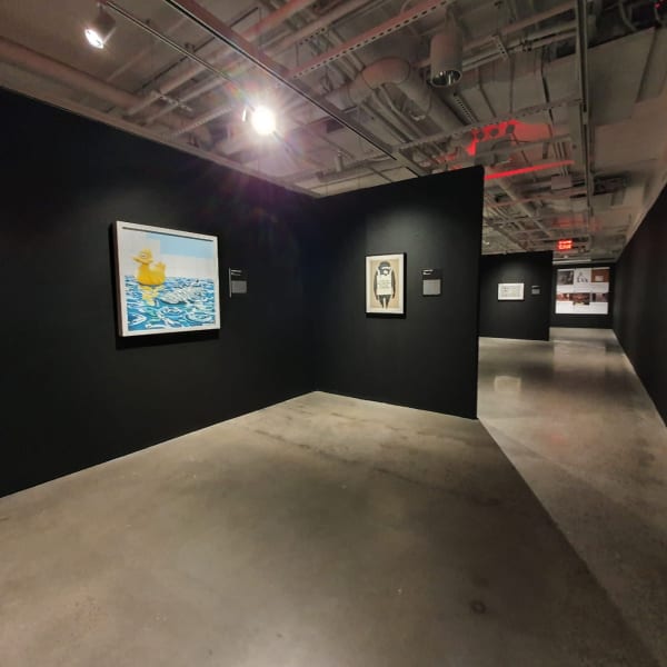 Banksy artworks hanging on wall