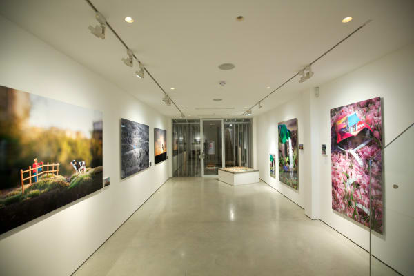 Slinkachu prints hanging in exhibition at andipa gallery.