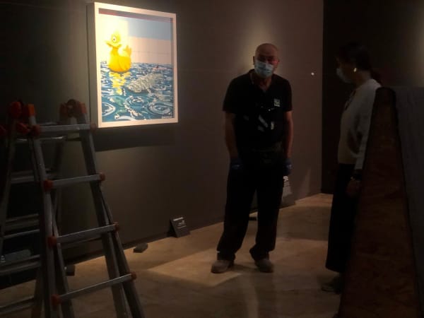 Banksy artwork hanging on wall