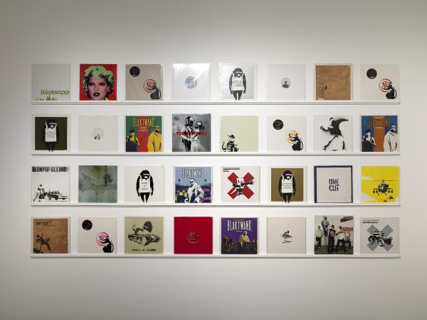 Banksy artworks hanging on wall