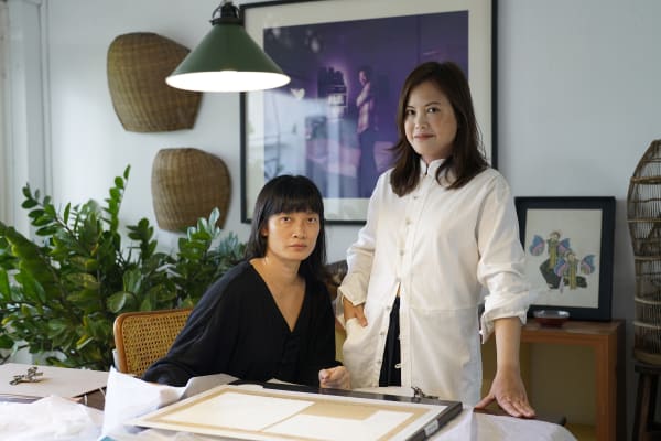 Artist Wei Leng Tay at home with her gallerist Audrey Yeo (Yeo Workshop). Photograph courtesy of Wei Leng Tay, clothing Lisa Von Tang