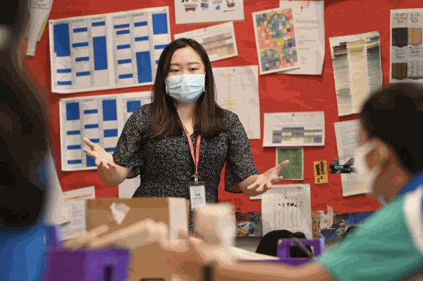 Shayne Phua teaching students from UWCSEA